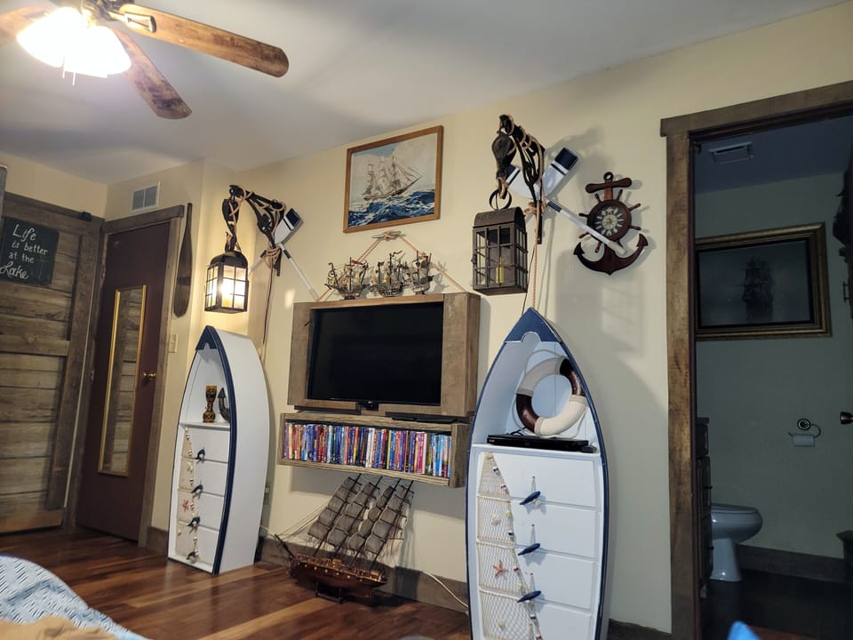 Large Bedroom with TV, DVDs and a half bathroom