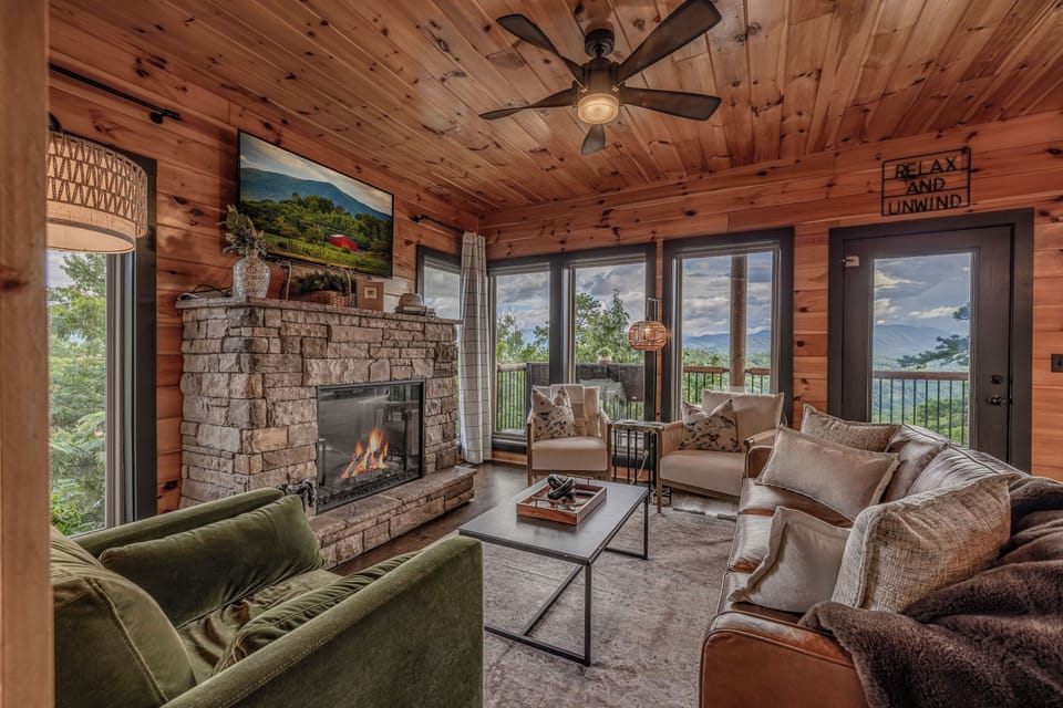 Main level living room with floor-to-ceiling windows to take in mountain view!
