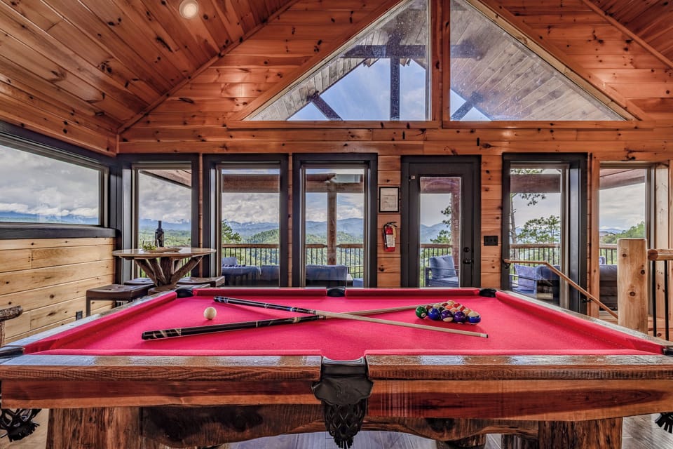 Upper level game room with pool table, foosball, arcade, and Mountain View!