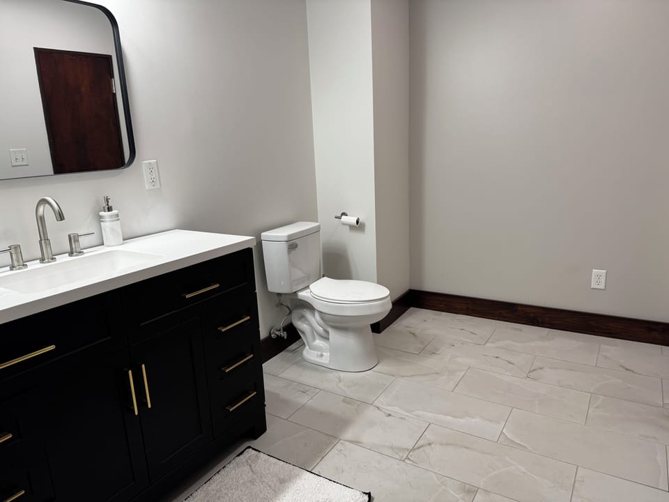 Elegant bathroom retreat with stylish fixtures and spacious walk-in closet.