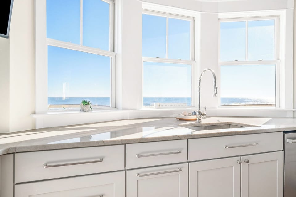 The sink is perfectly positioned to offer a stunning beach view, allowing you to enjoy the scenery while washing dishes or preparing meals.