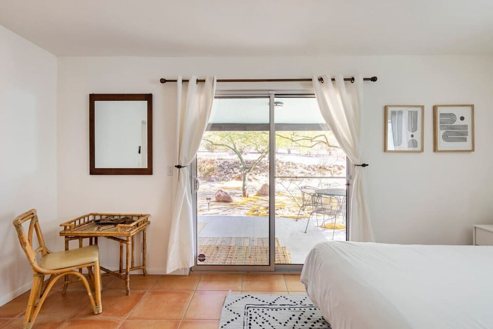 Slider off of the primary bedroom with a small patio and bistro set for your morning coffee