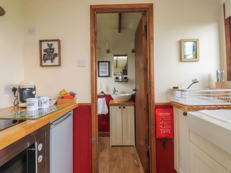 Fridge, electric kettle, toaster, cookware/dishes/utensils