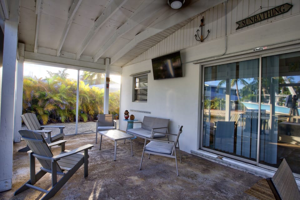 Back screened in Patio overlooking the Canal