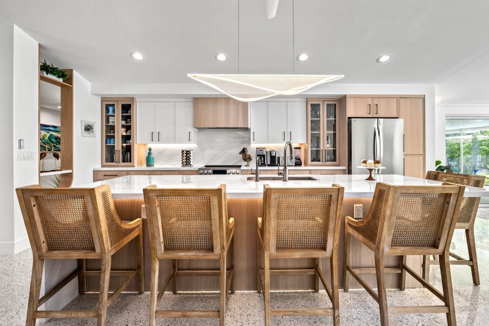 Pull up a stool at the sleek kitchen island and chat with loved ones while meals come together.