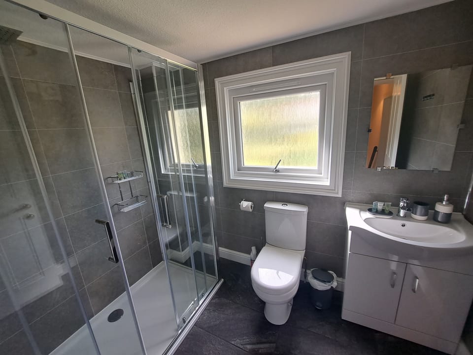 Main bathroom with rain shower.