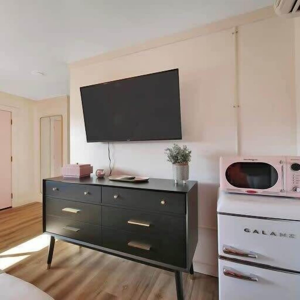 50" TV, retro minifridge with freezer plus a retro pink microwave