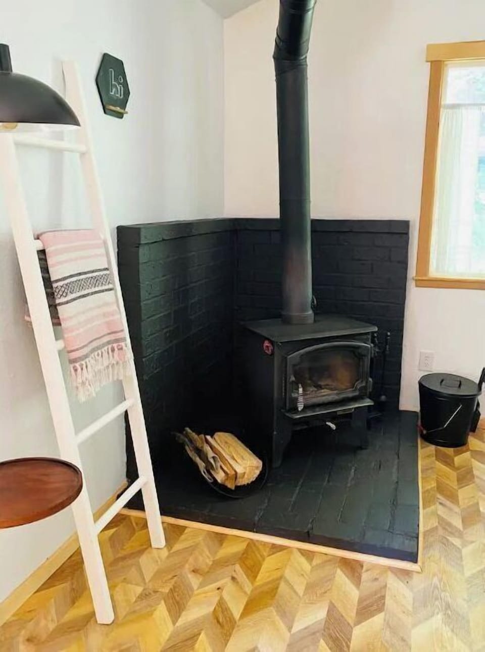 The cozy wood stove! A newly updated look and wood provided for use...