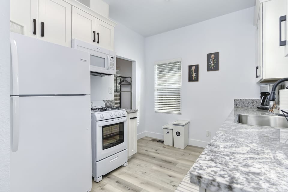 Fully equipped kitchen with microwave and gas stove