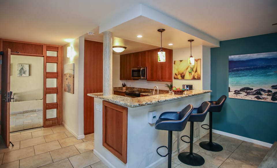 Gather together and mingle at the kitchen counter with bar seating for three.