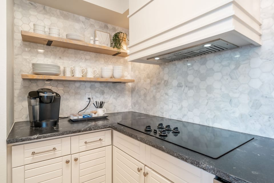 Keurig coffee maker and open shelves for convenience