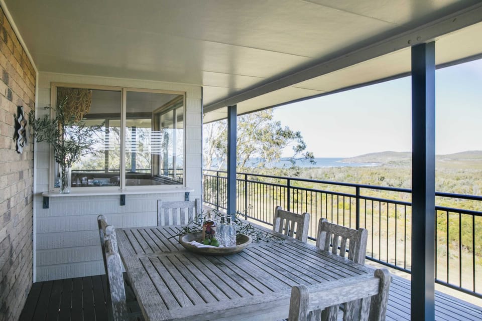 Upstairs outdoor dining with view of beach and national park