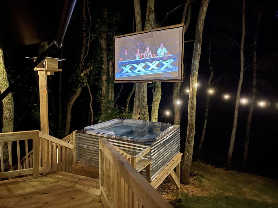 Enjoy outdoor theatre under the stars while relaxing in the hot tub.