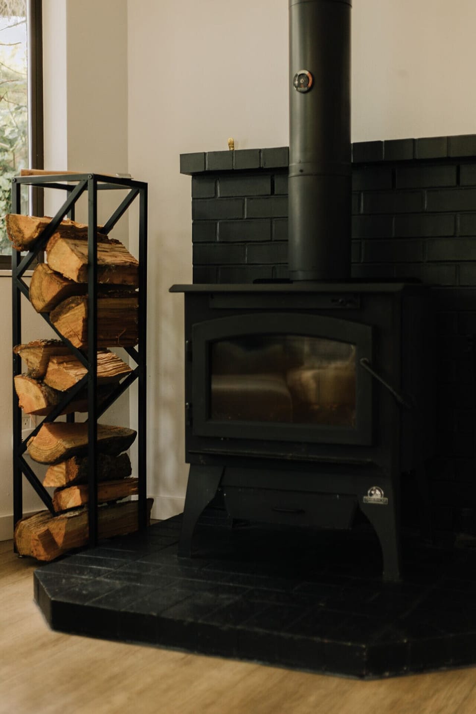 Warm and welcoming living space with a charming fireplace centerpiece.