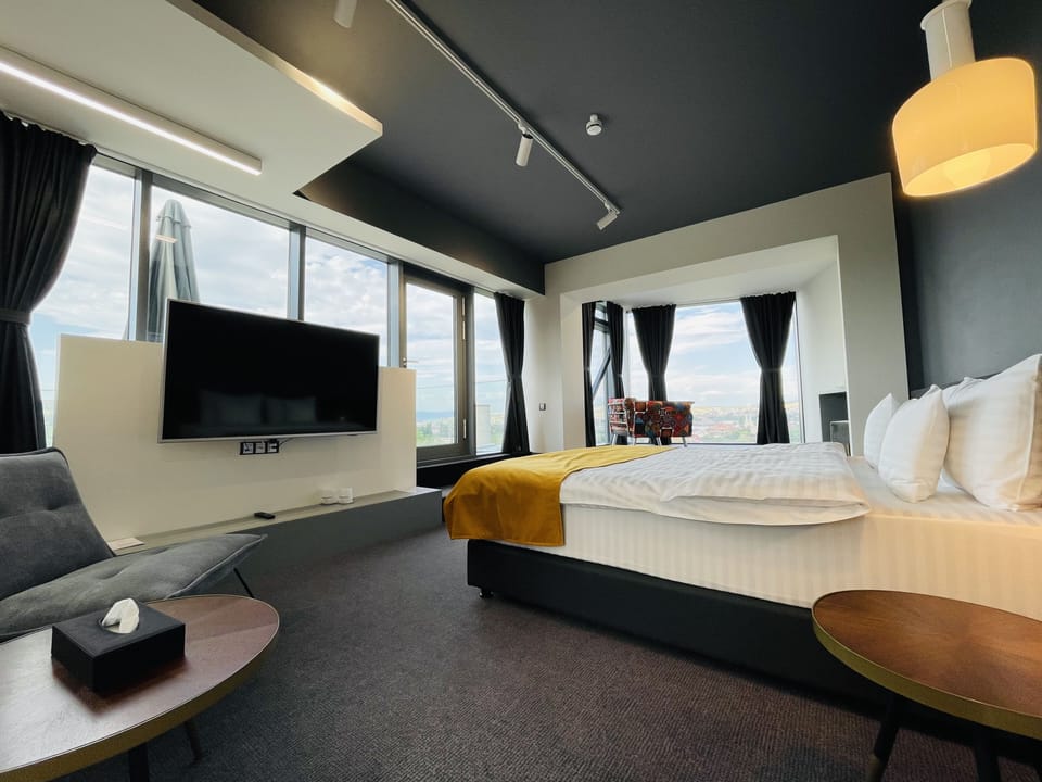 Family Studio, Patio, City View | Minibar, in-room safe, desk, laptop workspace