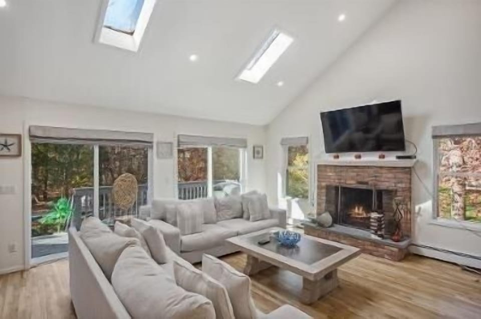 Large Modern Living Room. New White Couches. Hardwood Floors.  Smart TV