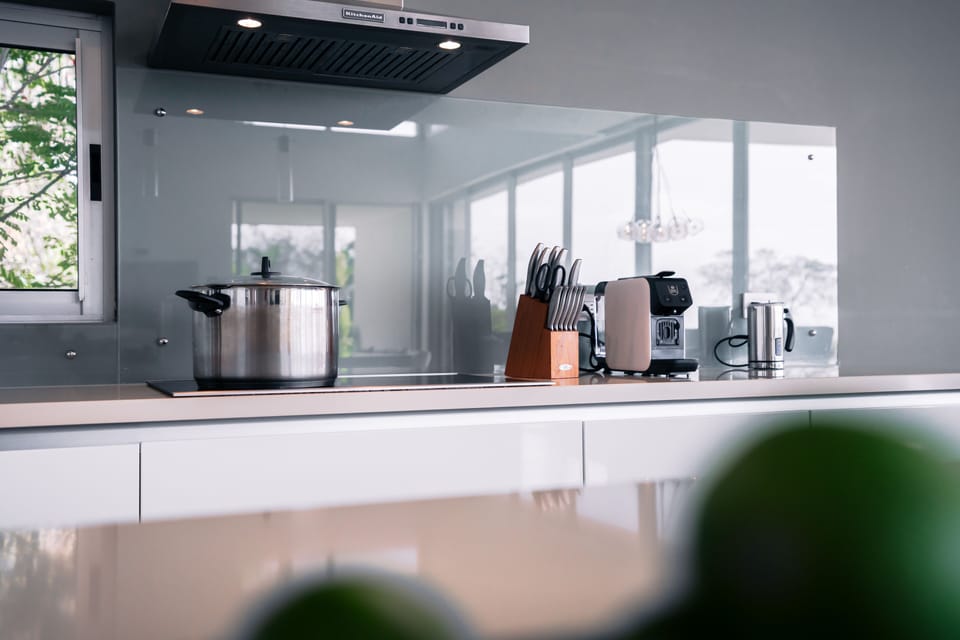 The modern and fully equipped kitchen invites you to cook