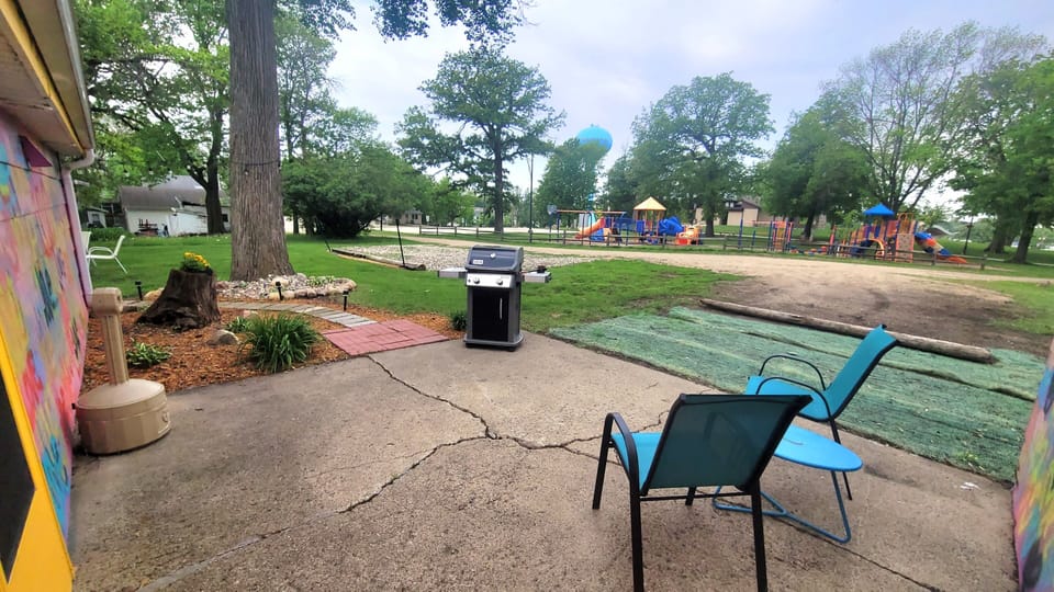 There is a little sitting area in the back next to the grill. 