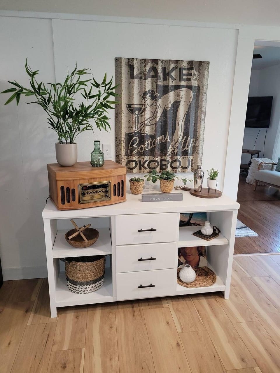 I guess this one picture wants to stay turned!? 
This works great as a provisions cart! Take the decor off and set up your bar cart. Be sure to bring your records, tapes and cd's so you can listen to all your favorites!