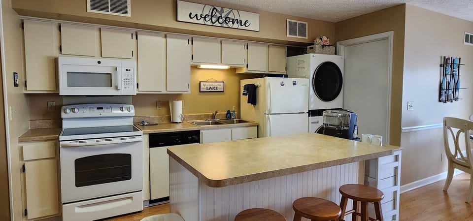 Kitchen with washer and dryer in view.  