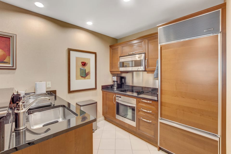 Kitchen = silverware, dishes, cookware, fridge, microwave, stove, Keurig, etc