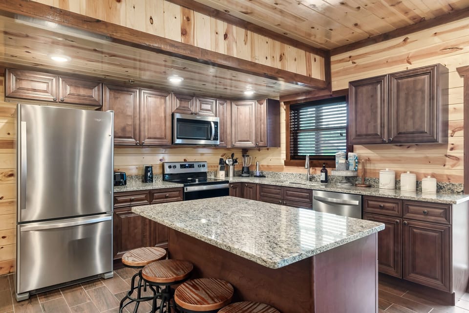 Large kitchen with island prep space all the kitchen items you could need 