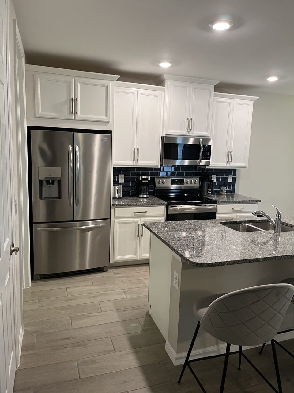 kitchen fully stocked with cookware and appliances