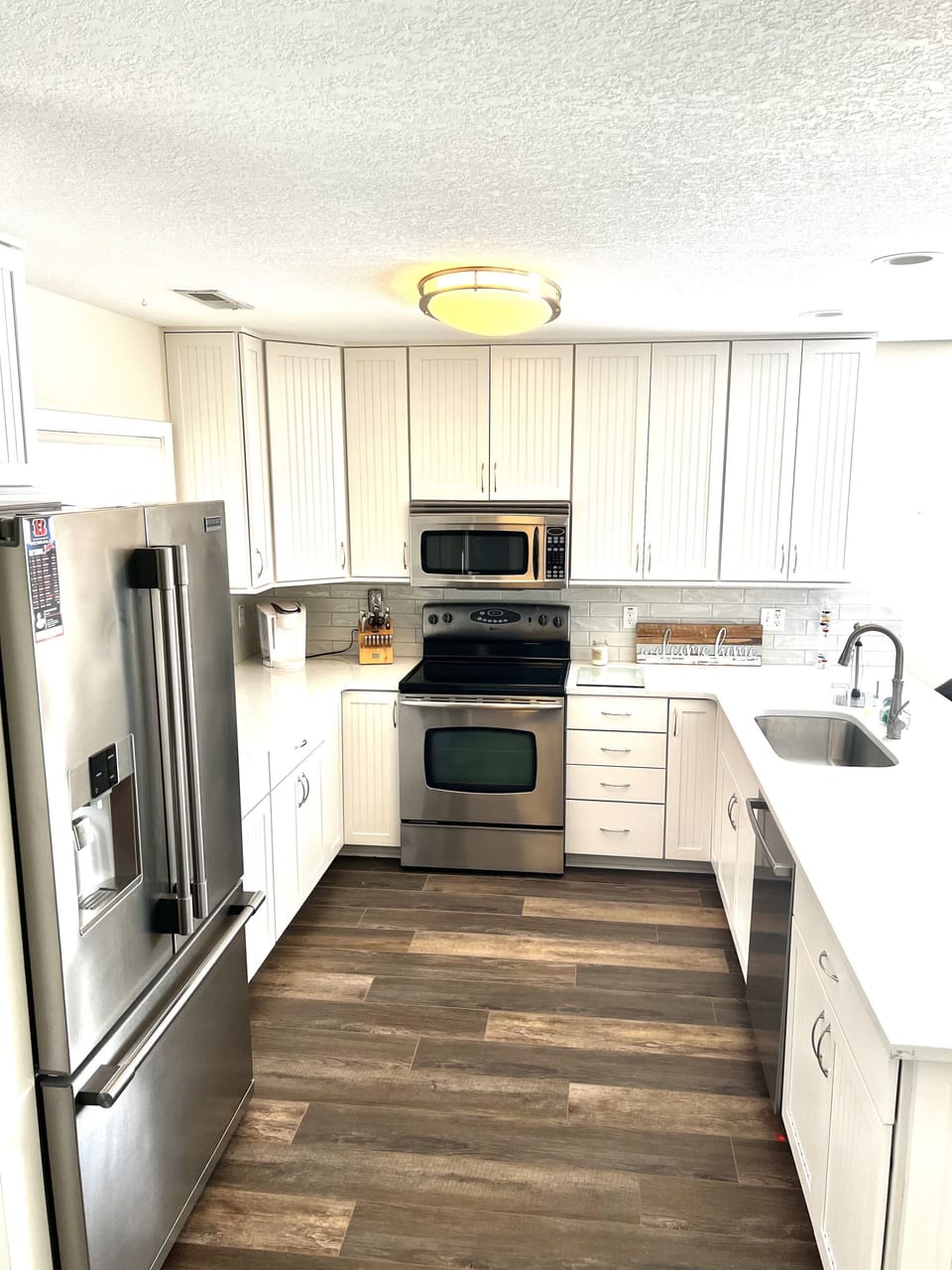 Full kitchen with stainless steel appliances 