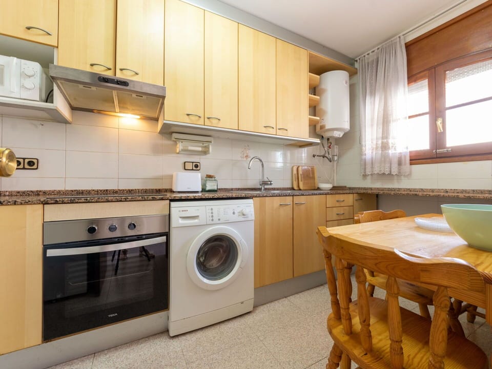 Cabinetry, Laundry Room, Countertop, Kitchen Stove, Kitchen, Kitchen Appliance, Washing Machine, Wood, Home Appliance, Clothes Dryer