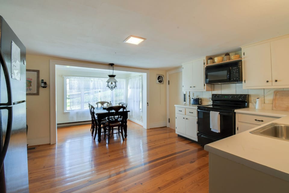 Kitchen breakfast nook and refrigerator.  I