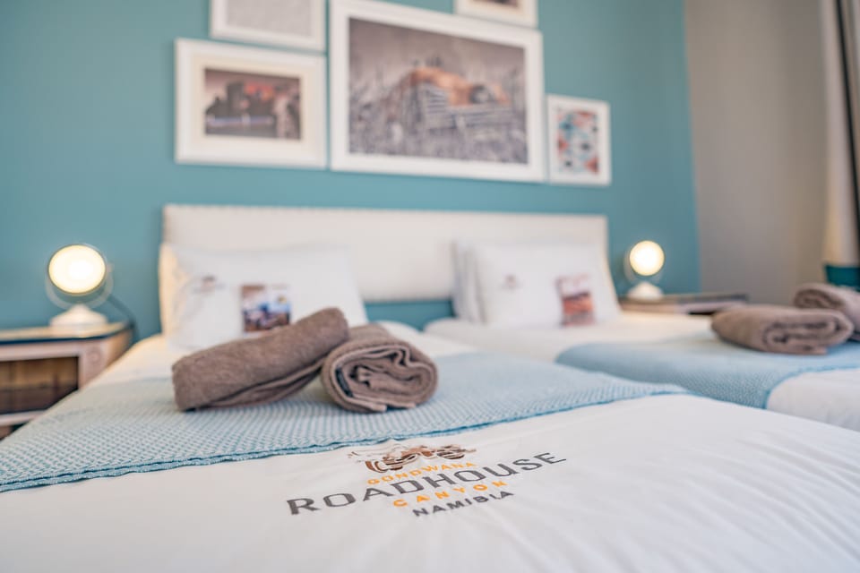In-room safe, desk, laptop workspace, bed sheets
