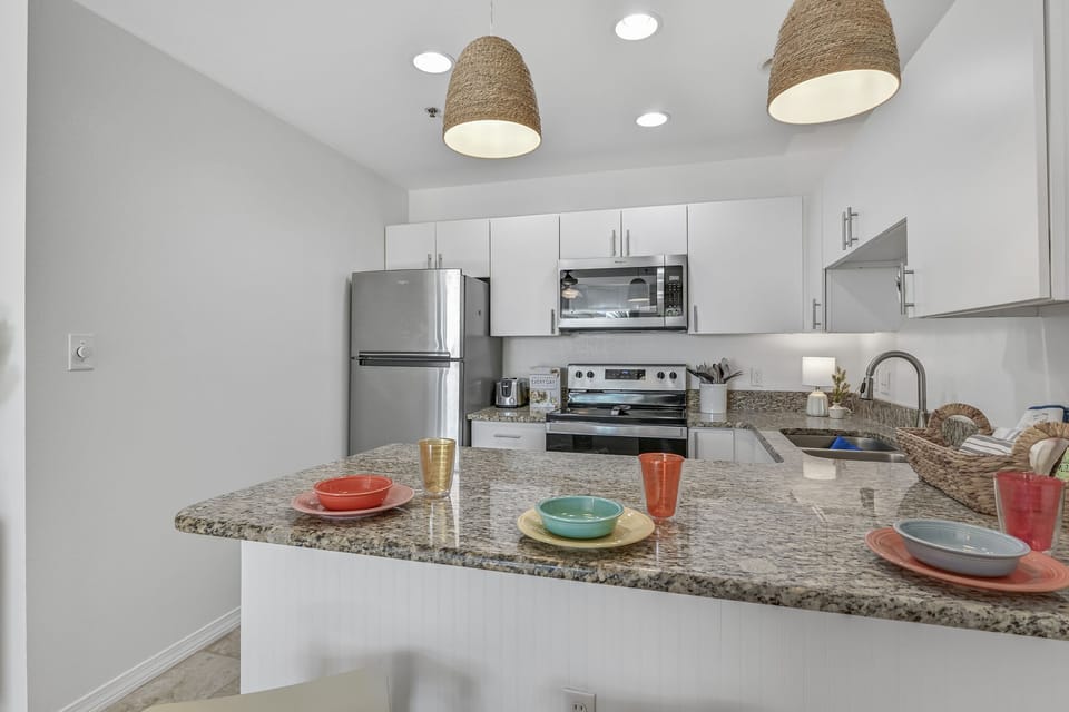 Your fully equipped kitchen features granite counters, stainless appliances, and everything you need to create memorable meals during your stay.