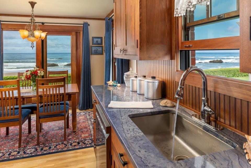 Oceanfront Kitchen - Beautiful new fir cabinetry, granite counters and oceanfront views as you prepare meals in this fully stocked kitchen.