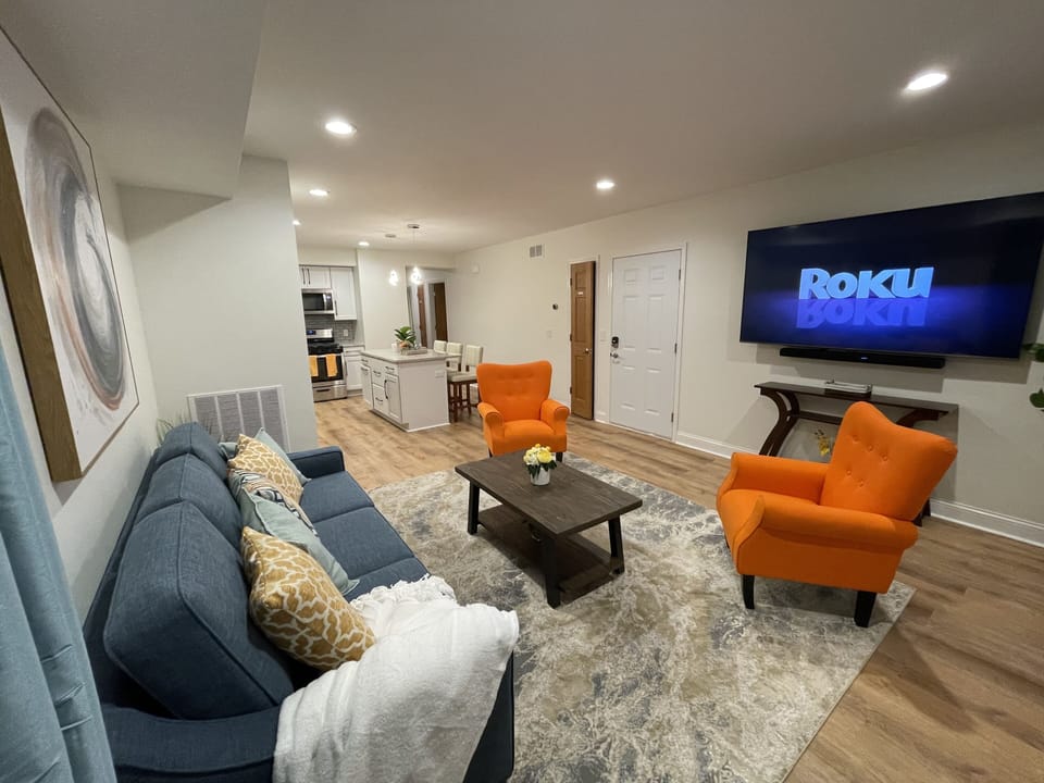 Open-concept Living/Dining/Kitchen area with pull-out sofa w/ queen size bed.