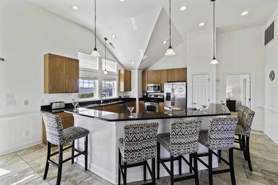 Gather around the 6-person breakfast bar with your first morning cup of coffee to plan out your day.