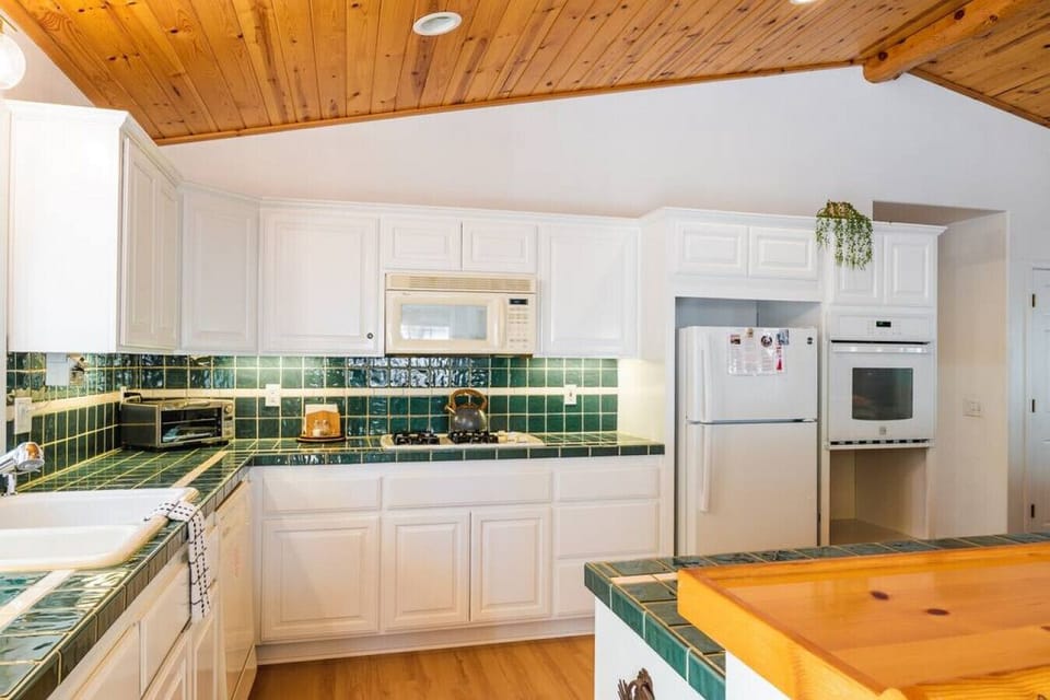 The kitchen features a great open floorplan with visibility into dining and living area.