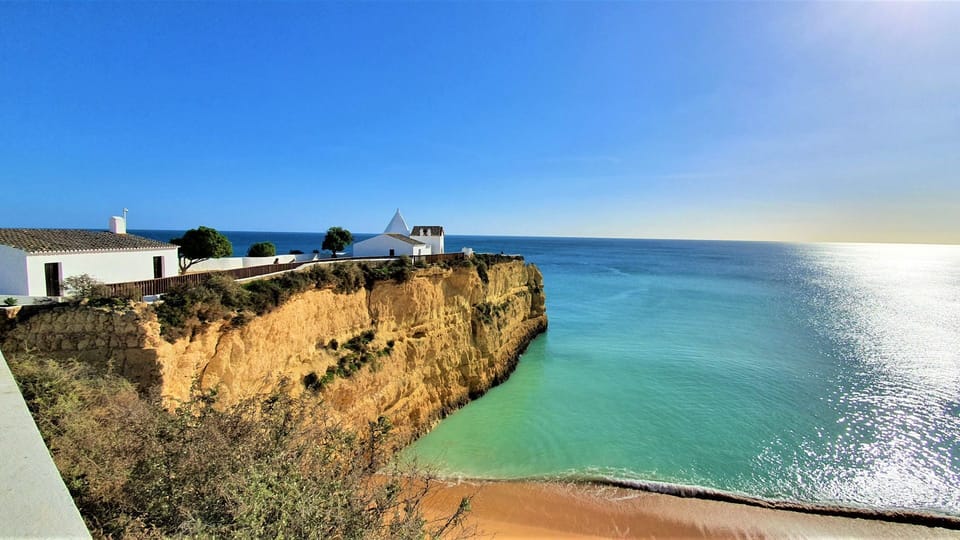 Beautiful golden sand beach with calm turquoise waters under a clear blue sky, inviting a perfect day of relaxation.
#Beach #SeaView #LovelyStay