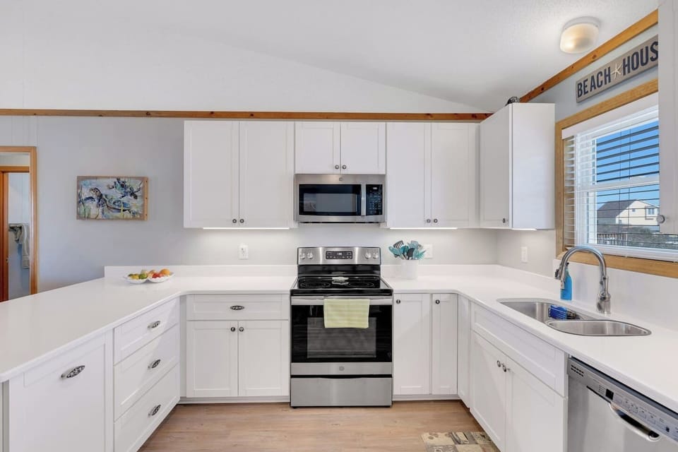 🍳 Bright, modern kitchen with island seating and plenty of space to cook and gather.