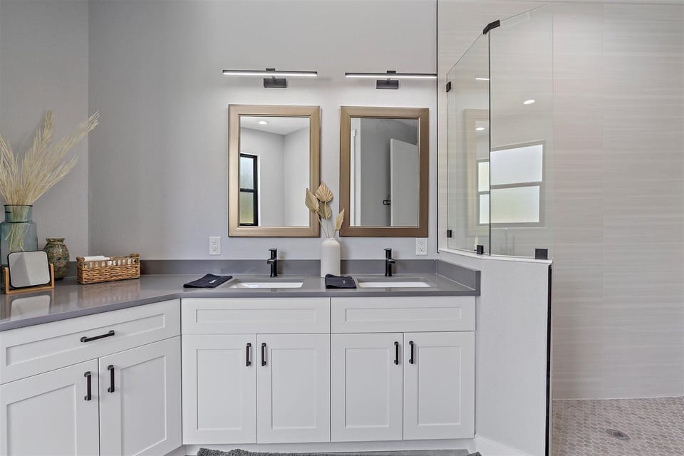 Full bathroom located in the hallway and through Bedroom 4. Has a standing shower, soaker tup, and double sink vanity!