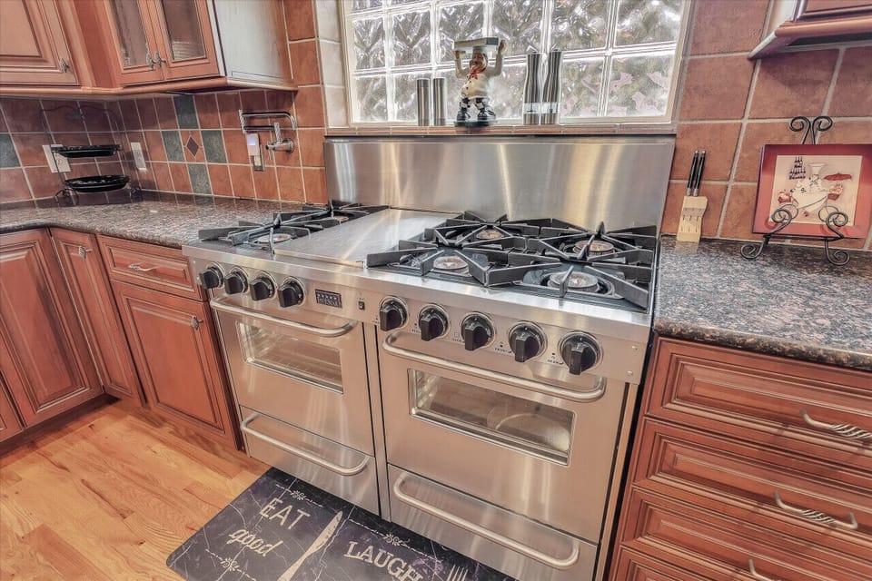 Sleek kitchen design with all the utensils you need for home-cooked meals.