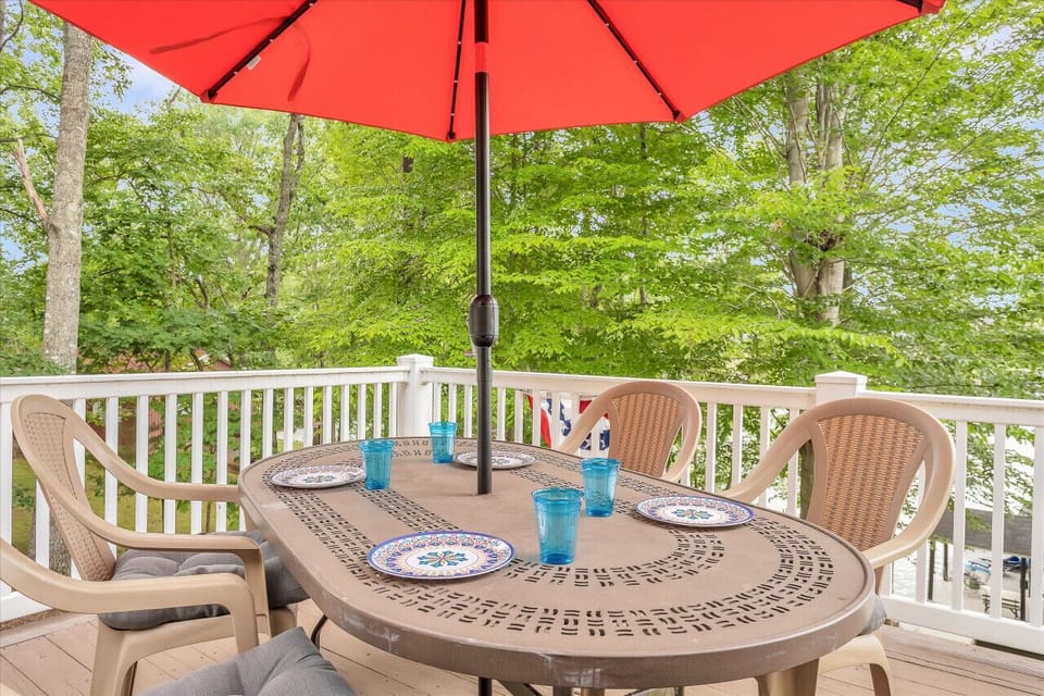 Bask in the sun or enjoy a meal on our deck with stunning views. The expansive deck offers a great spot for outdoor dining and soaking up the sun.