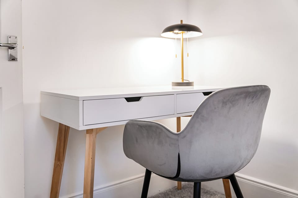 Private workspace with desk and chair — perfect for remote work, project stays and extended bookings. Fast Wi-Fi makes working from the flat easy and reliable.