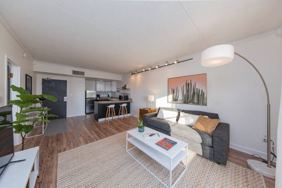 Open living room/kitchen concept. There are now 4 seats at the kitchen counter area.