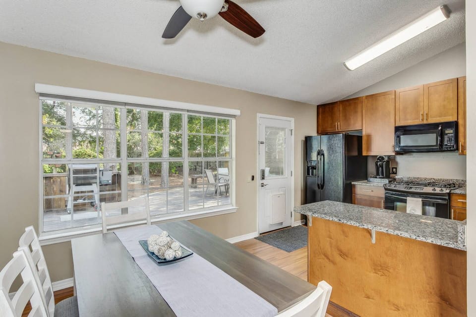 Kitchen and dining area overlooking the backyard