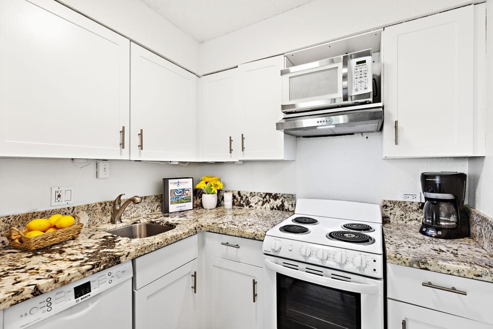 Remodeled kitchen featuring gorgeous granite countertops
