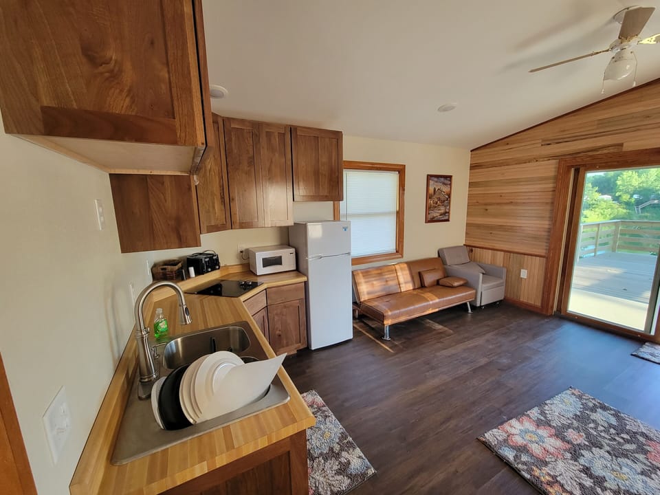 Main room, Kitchen, futon and chairs