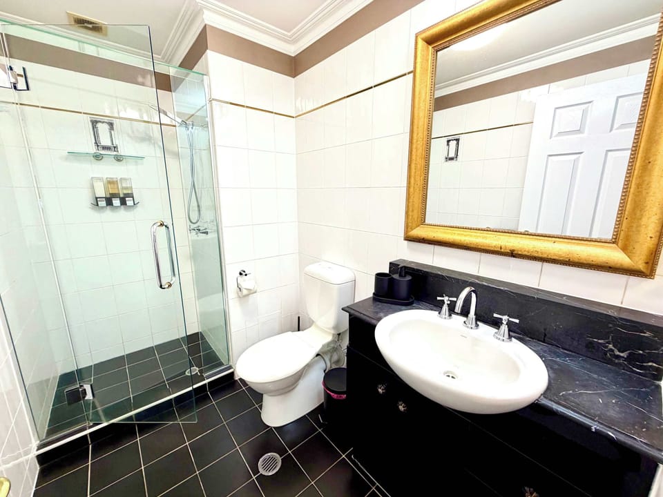 Fully Tiled Bathroom w frameless glass screen