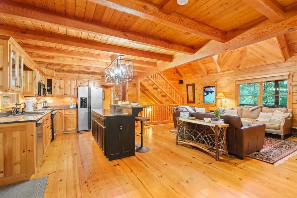 Open kitchen layout for families and friends to enjoy cooking and meals together. To complete this place, a uniquely designed, custom made 14 seater dining came from Canada.