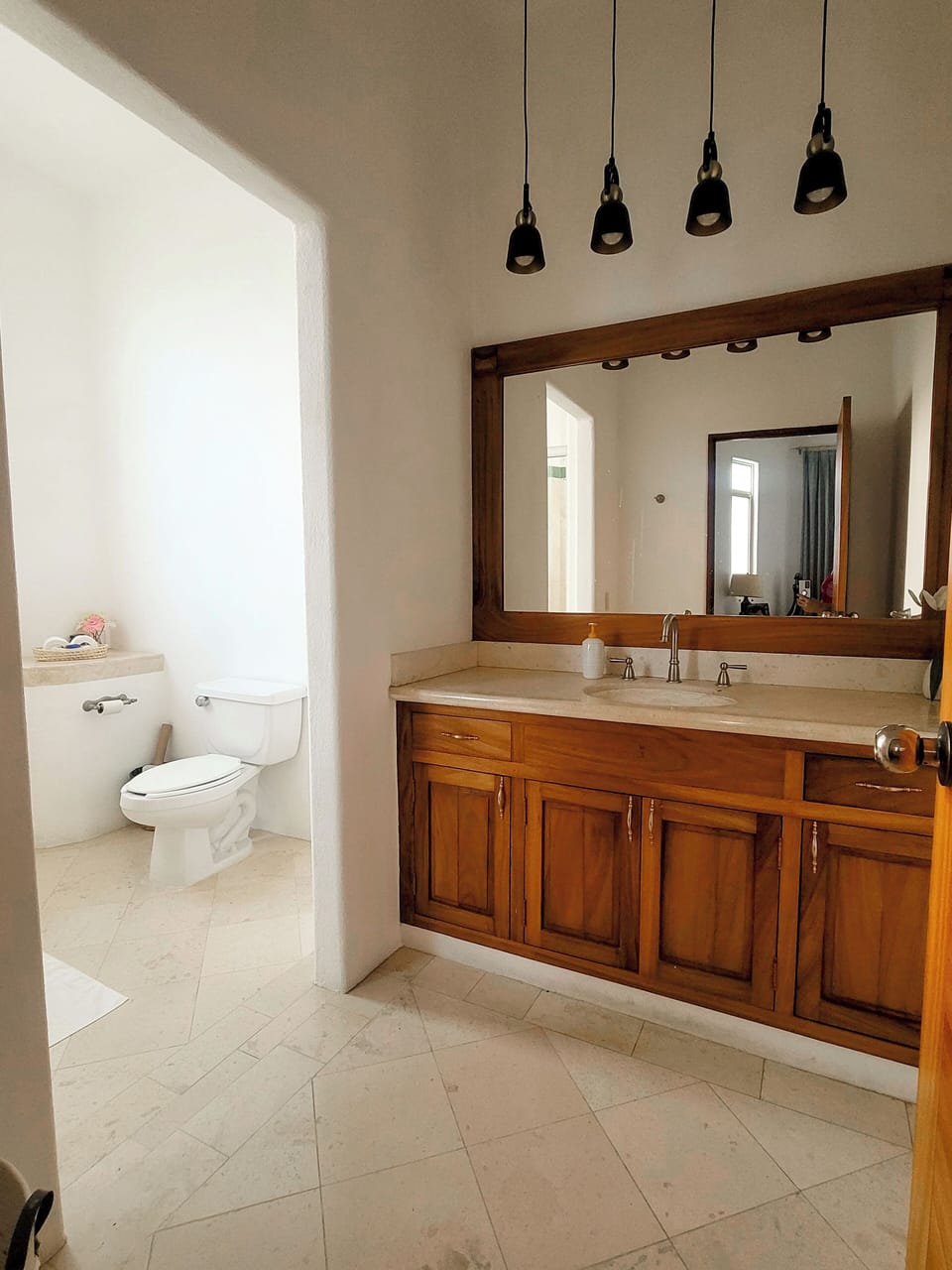 Master bedroom vanity and toilet (large walk-in shower is around the corner)