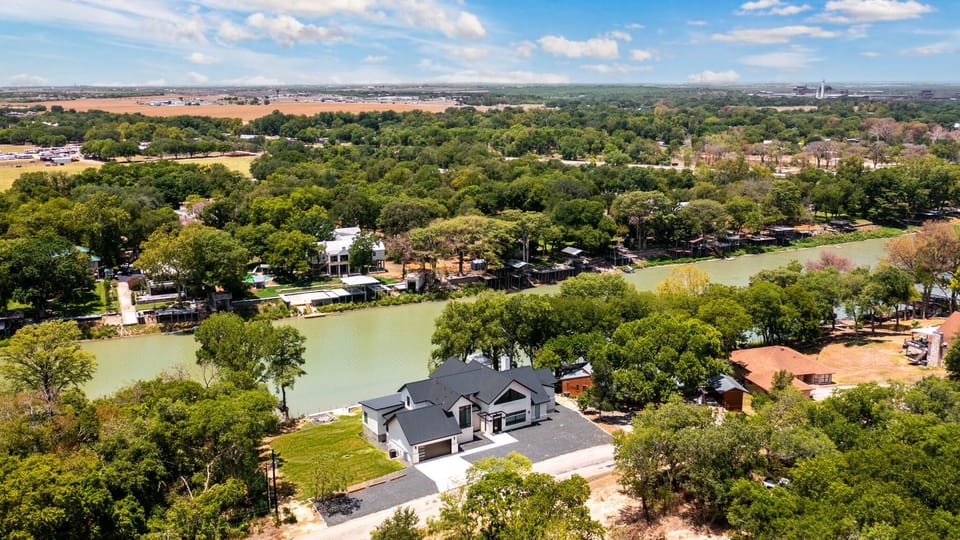 Drone view of the full property and lakefront setting